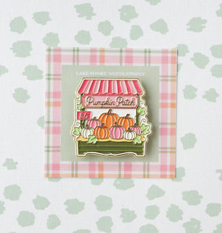 Lake Shore Needlepoint Pumpkin Patch needle minder with a market stand of pastel pumpkins