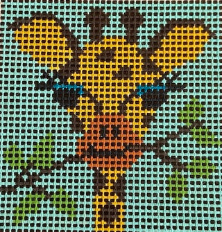 Purple Palm Designs Twiggy kids needlepoint kit canvas: yellow and brown spotted giraffe with long eyelashes among leafy branches