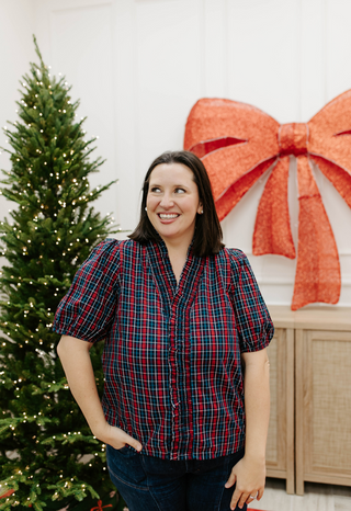 Home For The Holidays Top in navy, a plaid puff sleeve top with ruffled V-neck