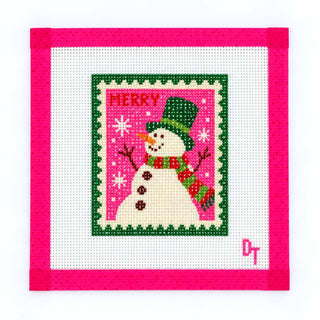 Duo Threads Frosty & Bright Snowman needlepoint canvas, 18 mesh mini design of a snowman in a green top hat and striped scarf on a pink postage stamp background